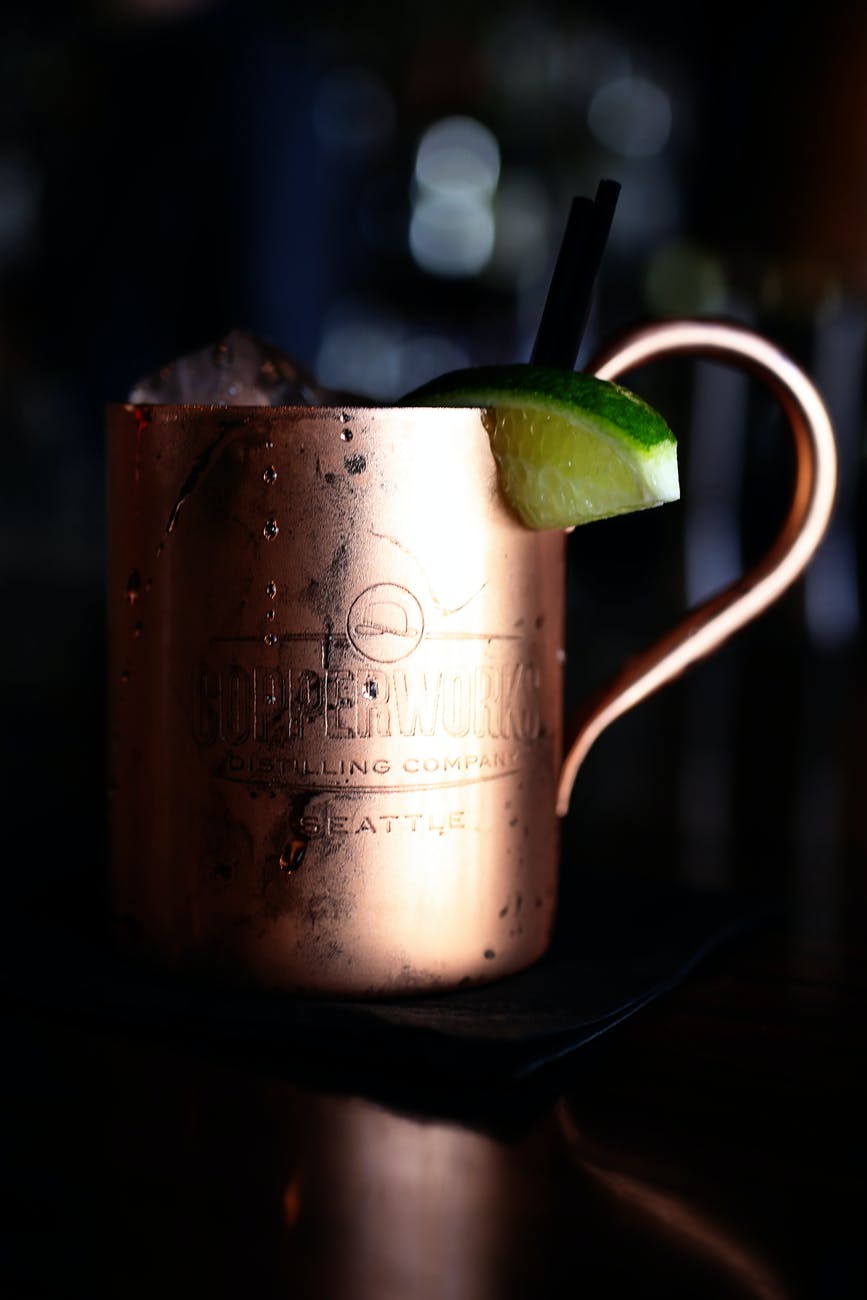 copper colored mug on table